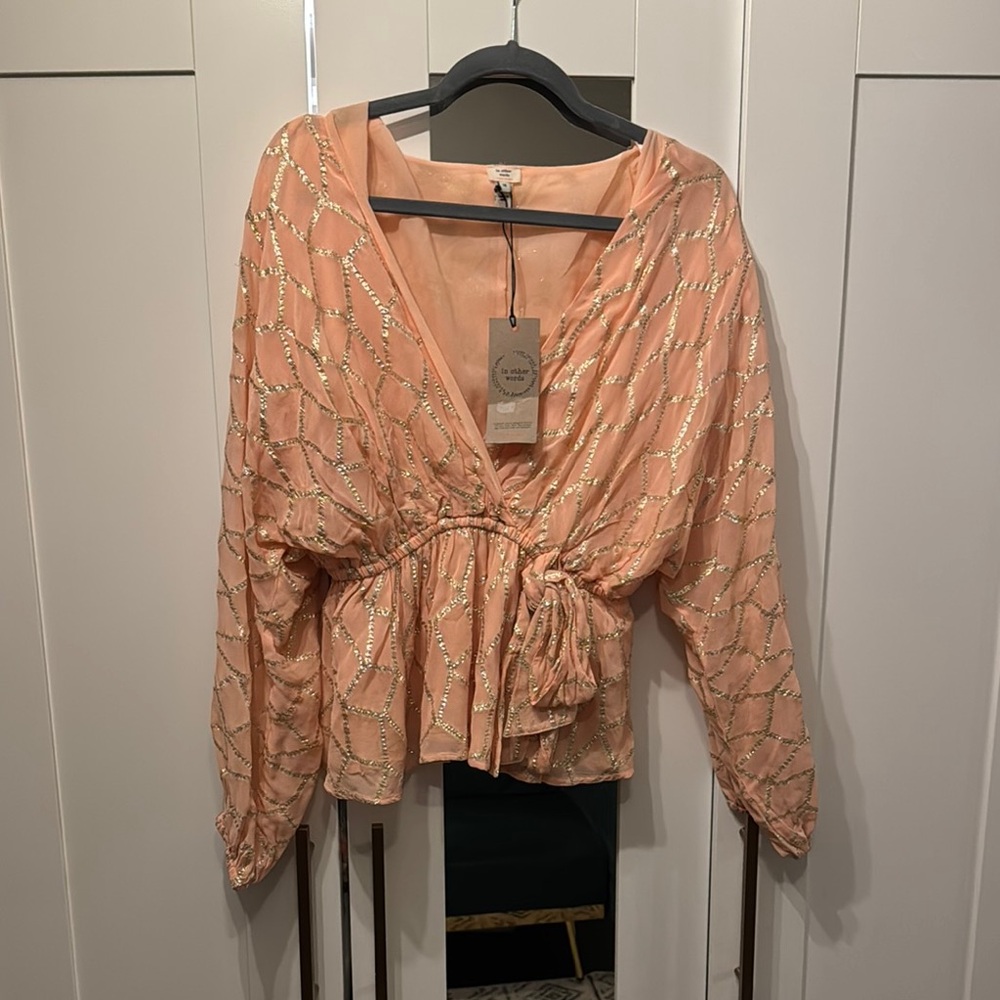 Elegant Peach Wrap Top with Gold Accents